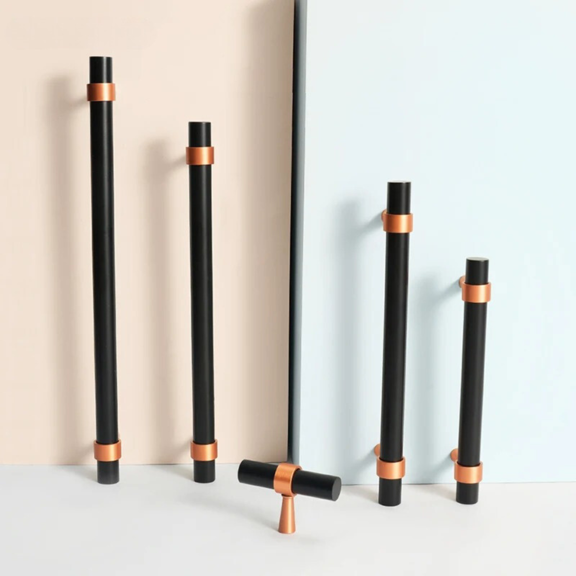 Five black and copper pulls of different lengths