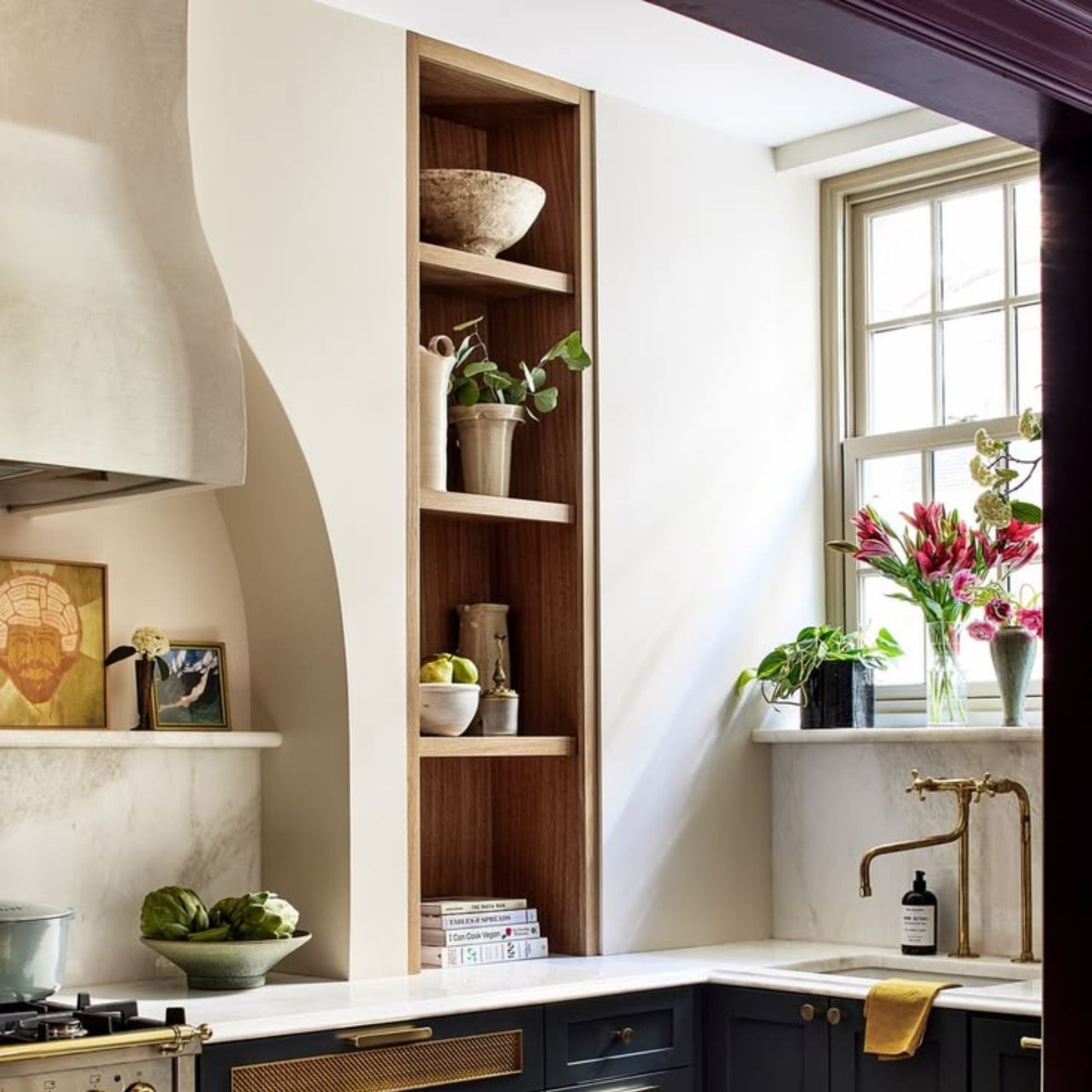 a mid century modern small kitchen with wooden shelving alcove. 
